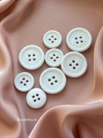 Пуговицы Прад. белые на прокол