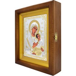 Икона Страстная Божией Матери в серебряном окладе, в деревянном киоте.