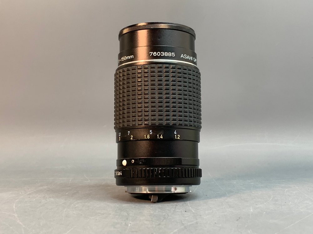 SMC Pentax-M 75–150 mm f/4 Небольшие точки внутри линзы