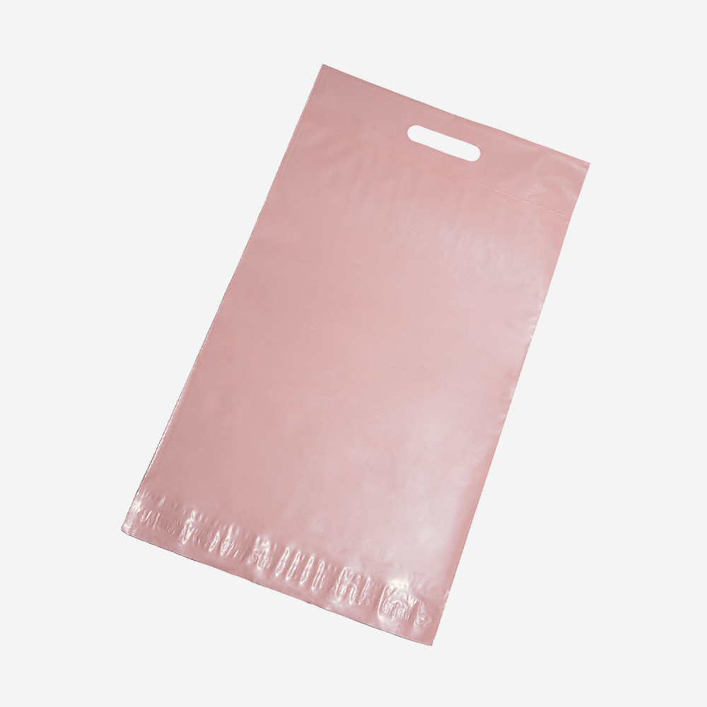 Пакет розовый с клеевым клапаном и вырубной ручкой, 41,5*29,5см