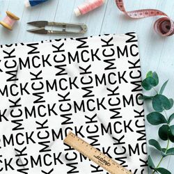 Ткань футер 2-х нитка узор из чёрных букв на бежевом фоне