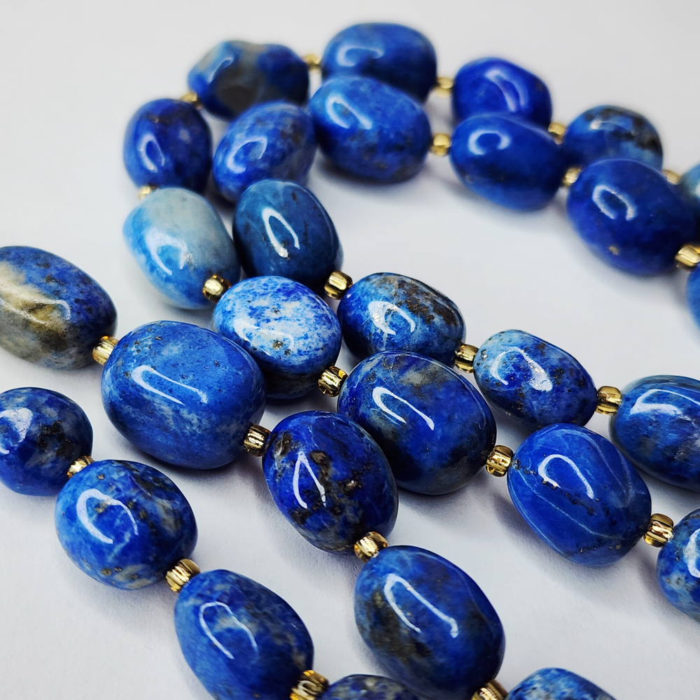 Лазурит с включениями пирита, крупная галтовка, 12-15 мм, камни овалы, цена за нить 12.5 - 13 см (1/3 нити)