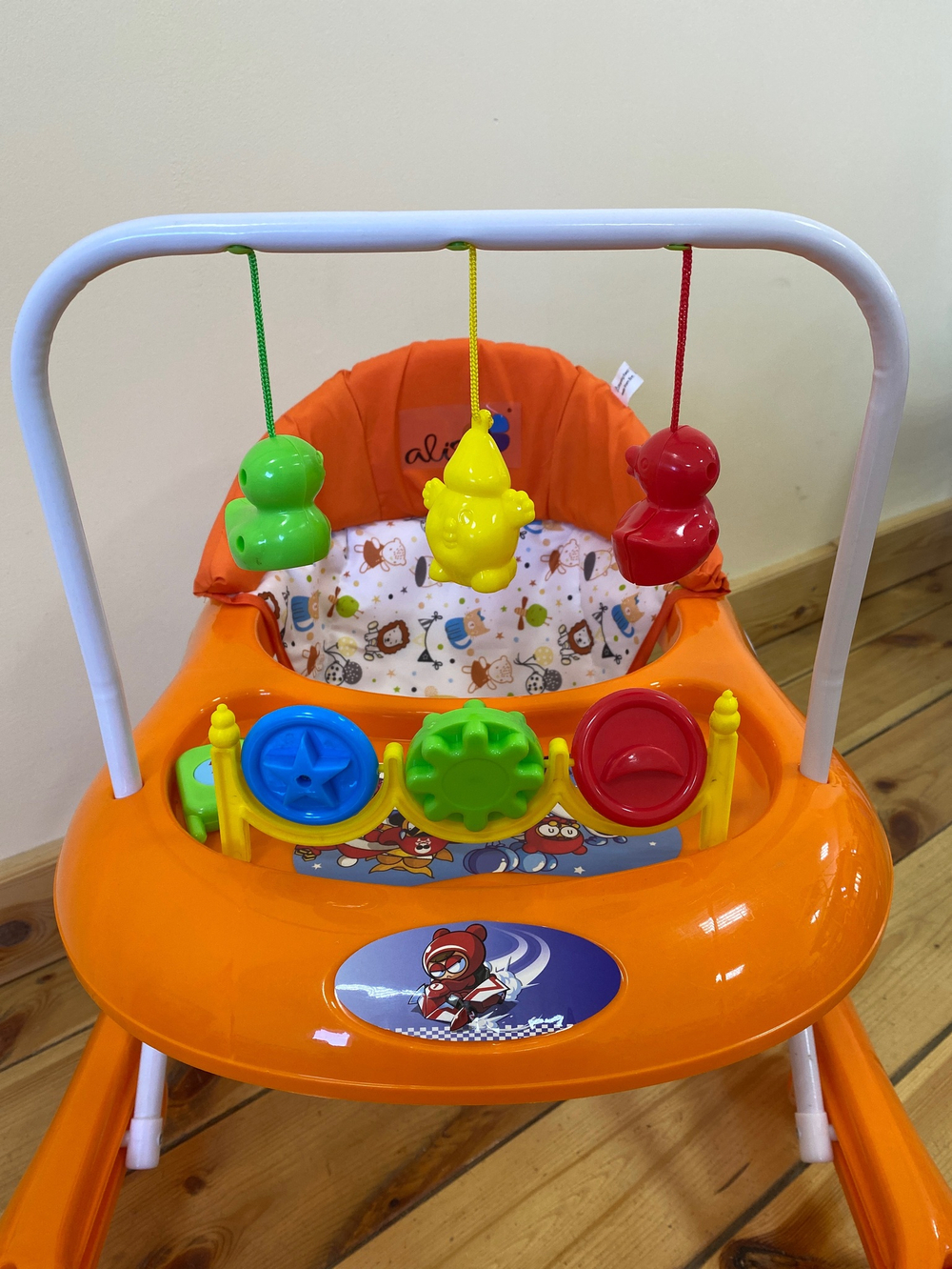 Ходунки "Весело шагать С", 8 силиконовых колес, муз., игрушки (Alis) (оранжевый)