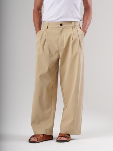 Бежевые брюки свободного кроя