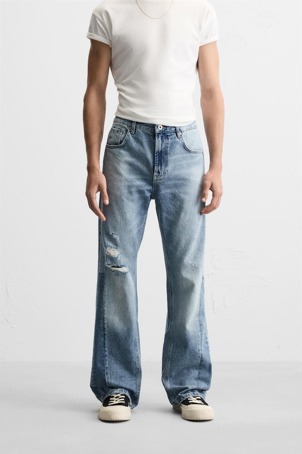 Джинсы flare fit с разрезами
