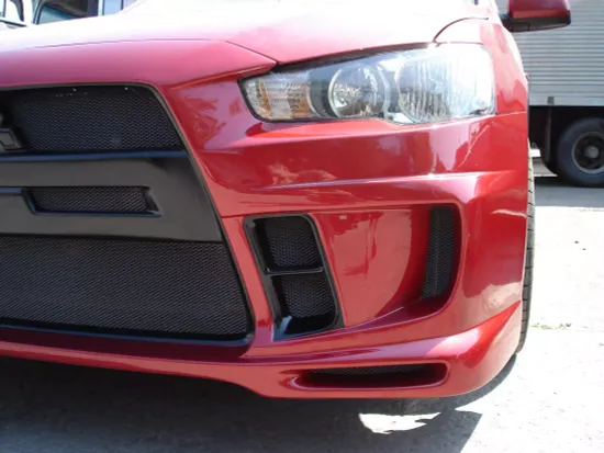 Бампер передний EXTREME для Mitsubishi Lancer 10