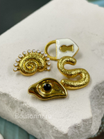 Пуговицы золотистые в форме глаза Скиапар.