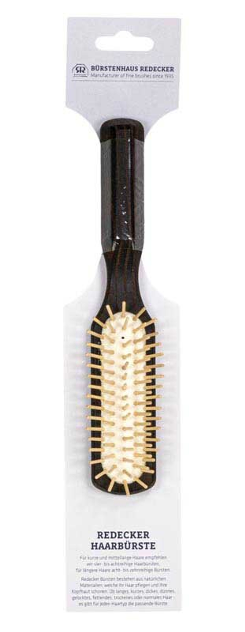 Продолговатая щетка для волос Redecker из термообработанной древесины с деревянными зубцами.