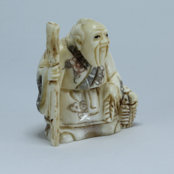 Эксклюзивная нэцкэ Монах с посохом и корзиной рыбы