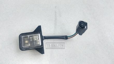 33720-K0W-N01. LIGHT ASSY., LICENSE. HONDA
