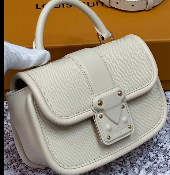 Сумка Louis Vuitton Hide And Seek кремовый