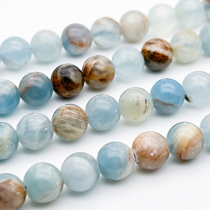 Кальцит голубой, диаметр около 8,9-9,2 мм, цена за 11 шт (1/4 нити)