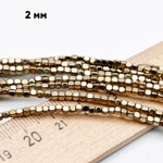 Гематит Куб бусины (имитация), цвет золотистый, размер около 2 мм, цена за отрезок 19 см (1/2 нити)