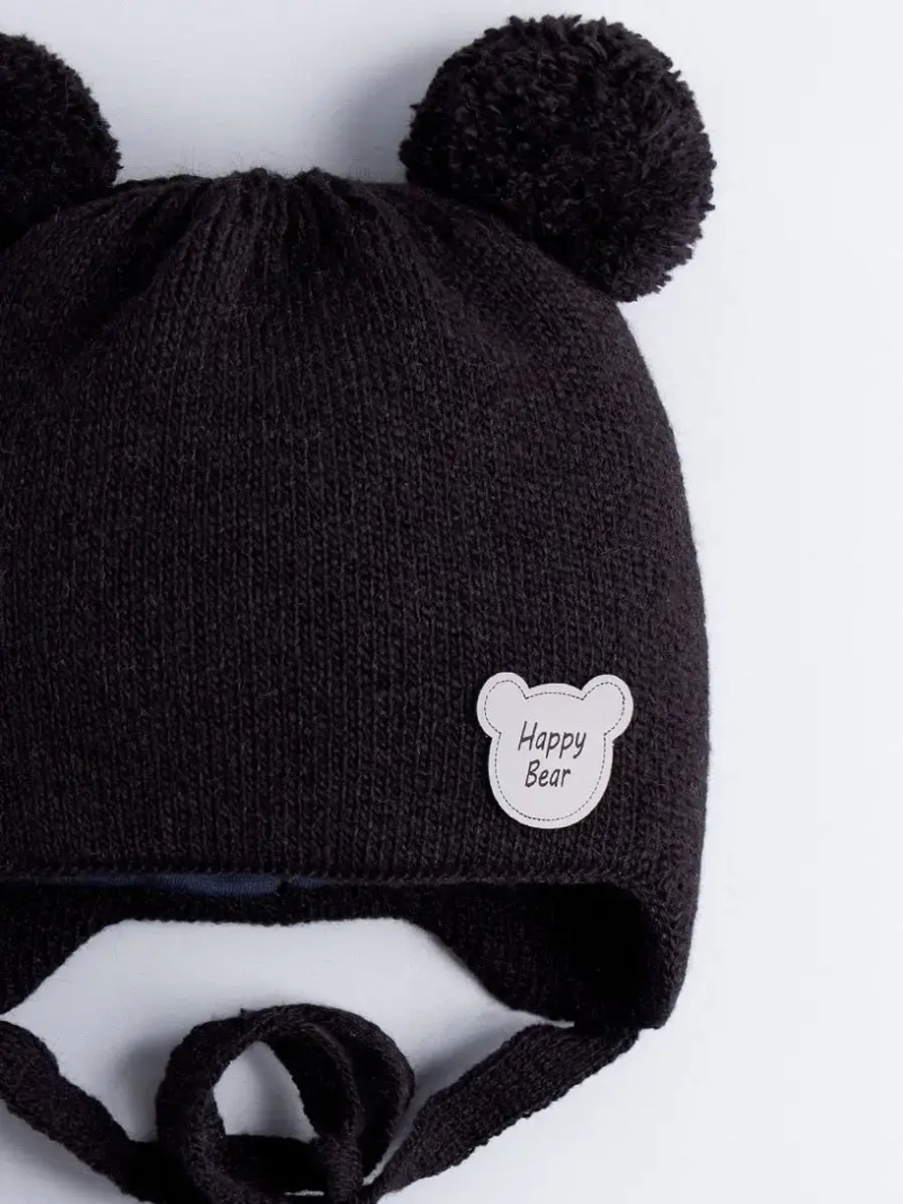 Шапка детская осенняя с завязками и помпонами