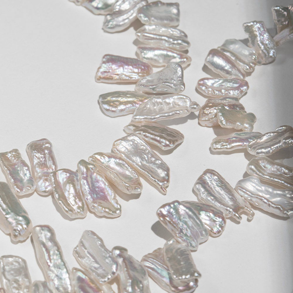 Жемчуг культивированный Бива, белый, со смещенным боковым отверстием 12-22мм