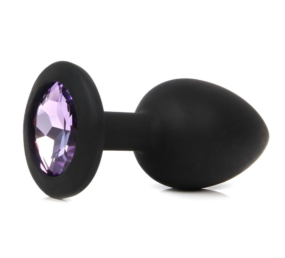 Черная анальная пробка с сиреневым кристаллом - 7,3 см. Черная анальная пробка с сиреневым кристаллом - 7,3 см.