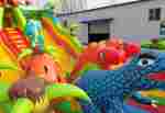 Коммерческий надувной батут "Хамелеон и динозавры" 15*7*7 м