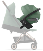 Коляска Cybex Coya Rosegold Frame Cloud T i-Size Leaf Green Plus Mirage Grey с дождевиком и бампером