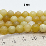 Опал желтый, диаметр 8,1-8,4 мм, цена за 12 шт (1/4 нити)