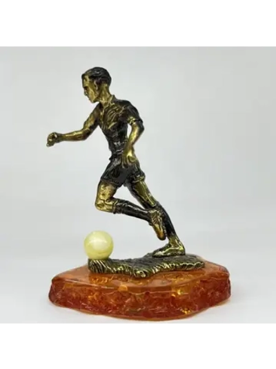 Бронзовая статуэтка на янтаре