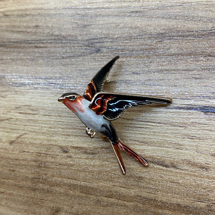 Брошь Ласточка эмаль оранжевая белая черная металл золотистый