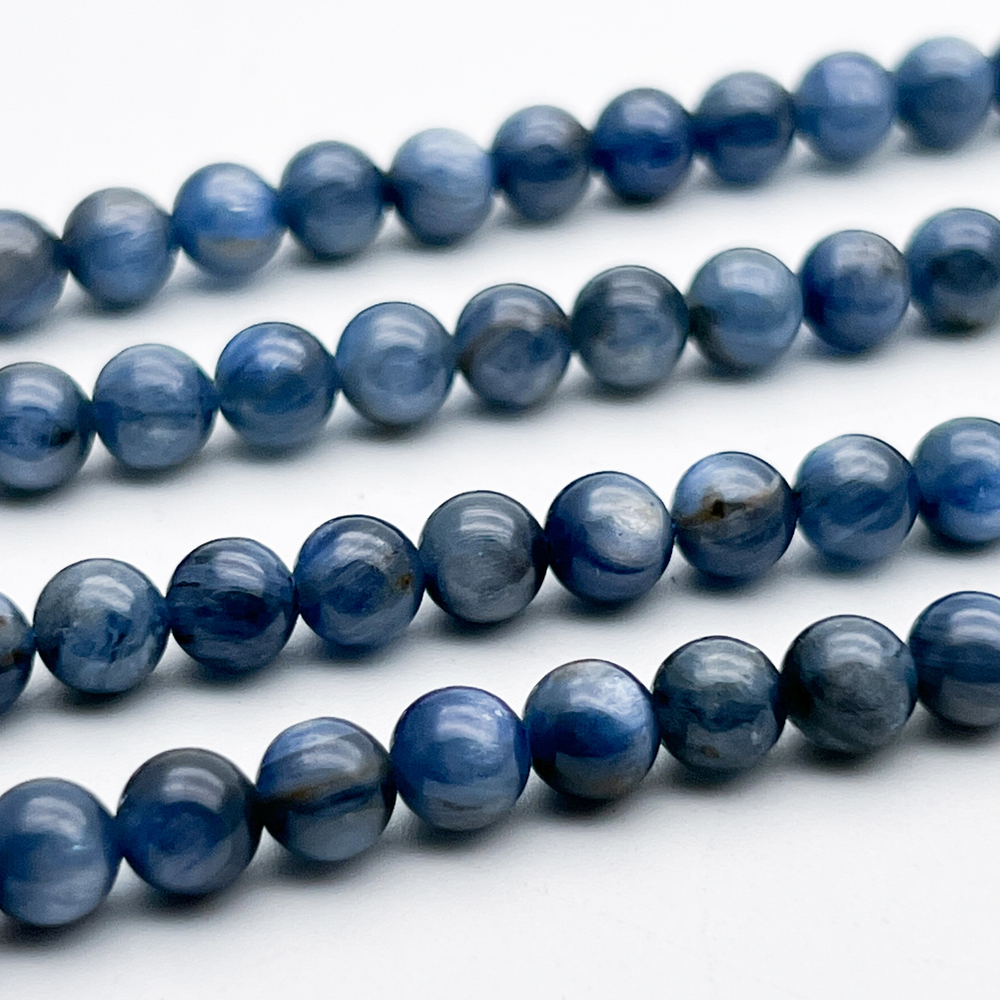 Кианит бусины (тонирован), диаметр 5,9-6,1 мм, цена за 16-17 шт (1/4 нити)