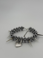 sharp medallion necklace