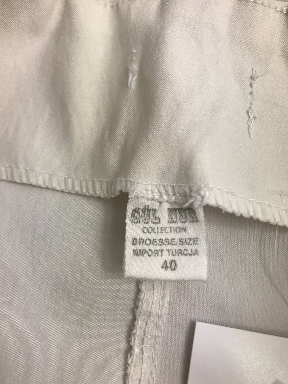 Брюки с контрастными карманами 40 размер