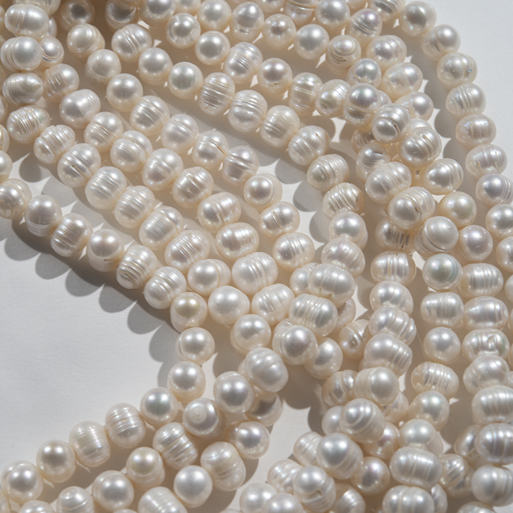 Жемчуг культивированный крупный овальный с бороздками, белый, 11*8мм