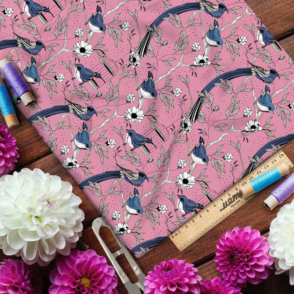Ткань габардин мелкие снегири, цветы и птичьи клетки на розовом фоне