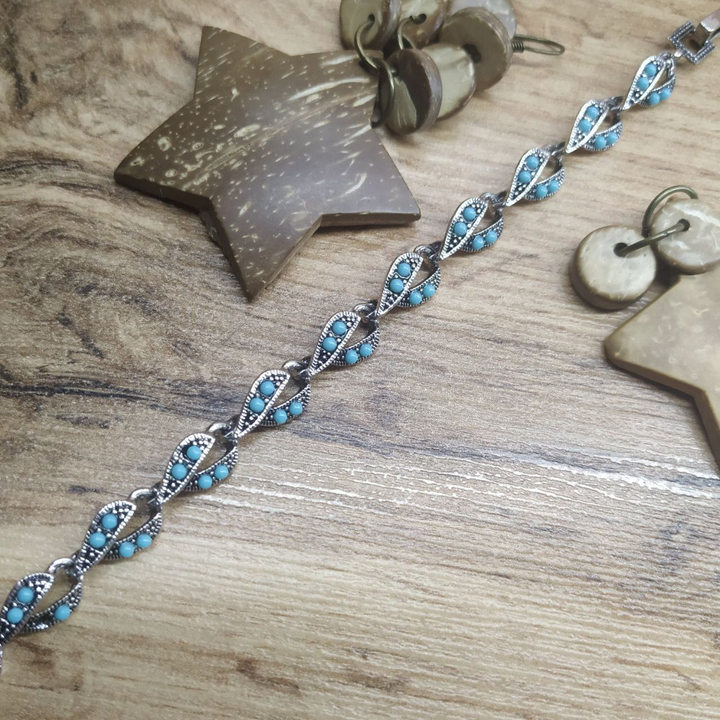 Браслет Vogue Воротничок бусинки голубые металл серебристый на красном бархате