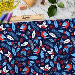 Ткань блэкаут голубые снегири и листья с шишками на синем фоне