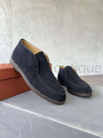 You are considering men's high black suede loafers Loro Piana Open Walk, which have a brown sole. These loafers are a premium product from the Italian brand Loro Piana. They are made of high-quality black suede, which gives them an elegant and stylish look. Loafers have high sides, which makes them more suitable for cool windy or rainy weather. They can also be worn in winter, which is very convenient for men traveling by car, as an additional fur insole is included that allows you to withstand frost up to - 5 degrees. The brown sole adds contrast and appeal to the overall look of the pair. Open Wolf premium loafers will emphasize your personality and give your image sophistication.
