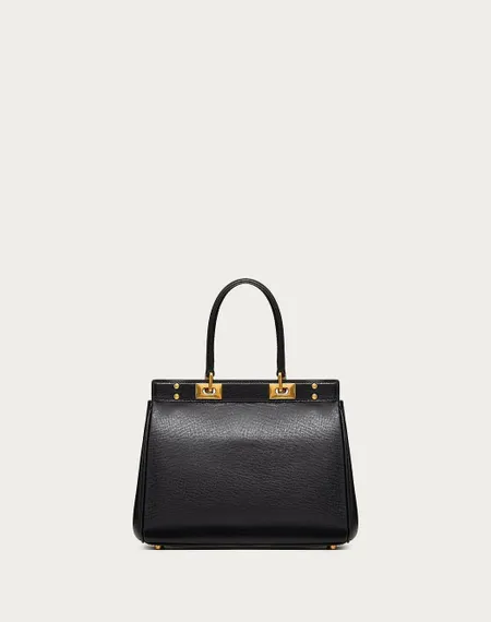 Средняя сумка с ручкой Valentino Rockstud Alcove из зернистой телячьей кожи черный