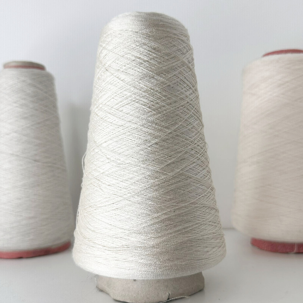 IDO MINOLA; 100% шелк; 3000м/100гр, (2/60); col.9813 blu, цвет: белый жемчужный. ТОЛЬКО бобинки: 175, 228 гр.