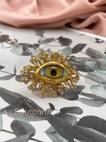 Кольцо Скиапар. крупное золотистое в форме глаза со стразами