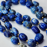 Лазурит с включениями пирита, крупная галтовка, 12-15 мм, камни овалы, цена за нить 12.5 - 13 см (1/3 нити)