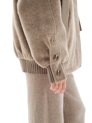 Бежевая куртка с вязаными вставками