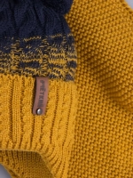 Шапка вязаная для мальчика на завязках и снуд