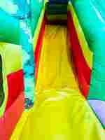 Коммерческий надувной батут "Джунгли" с горкой, 9*6*4.5 м