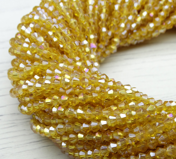 ББ003ДС3 Хрустальные бусины "биконус", цвет: шампань AB прозрачный, размер 3 мм, кол-во: 95-100 шт.