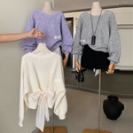 Женский свитер с декоративным бантом на спине