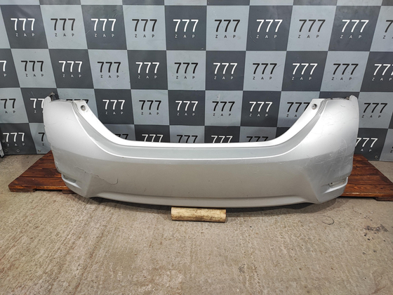 Бампер задний Toyota Corolla E180 5215902A20