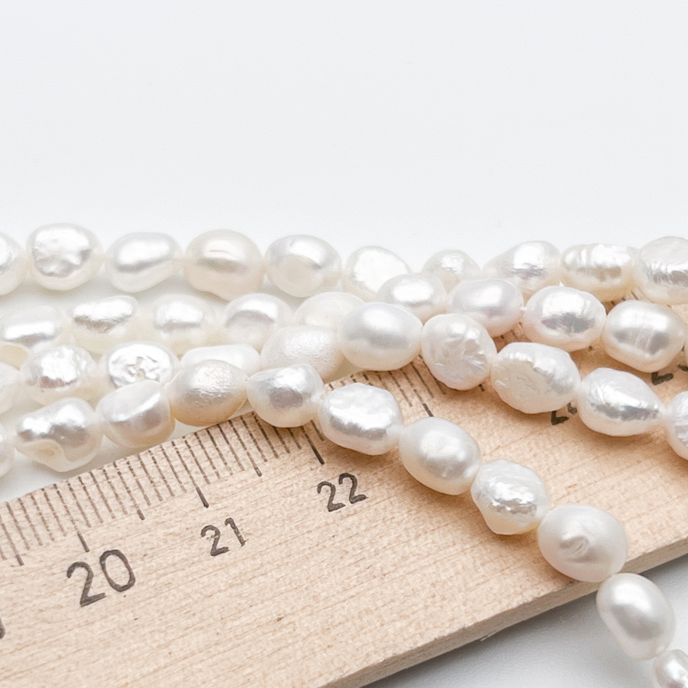 Жемчуг, размер около 6,5-7*5,7-6 мм, цена за нить 38 см