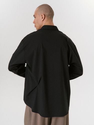 Черная хлопковая рубашка с асимметричными защипами