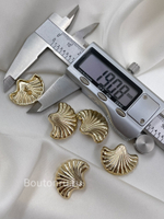 Пуговицы Скиапар. золотистые в форме ракушки