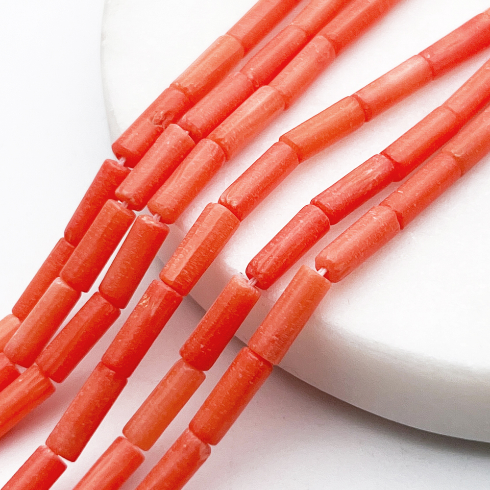 Коралл тонированный бусины, размер около 9,5*3,5 мм, цена за 20-21 шт (1/2 нити)