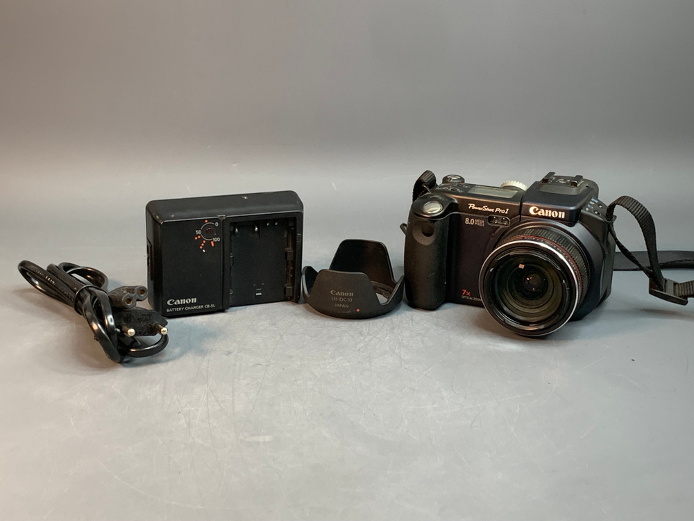 Canon PowerShot Pro1 внутри линзы пыль