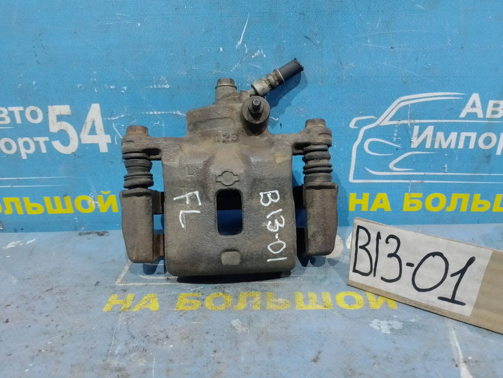 Суппорт тормозной передний левый NISSAN SUNNY 1991