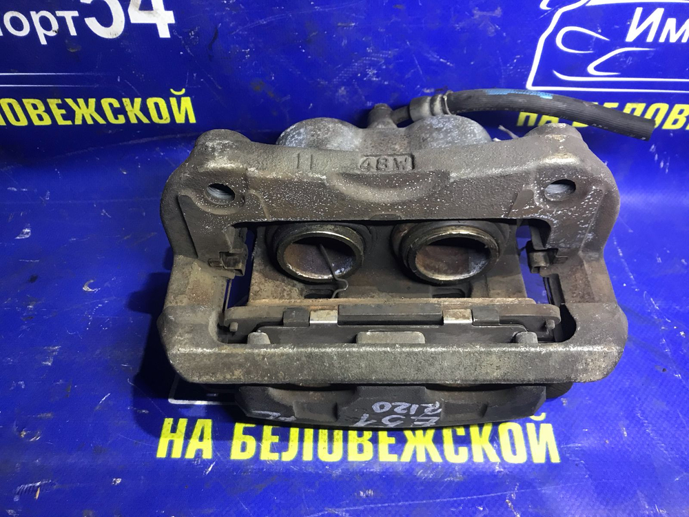 Суппорт тормозной передний левый NISSAN ELGRAND 2002-2010